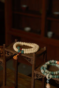 Eternal Balance White Jade-Bodhi Red&Green Accent with lotus seedpod Double-Loop Bracelet on shelf