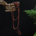 108 smooth sandalwood bead meditation bracelet with natural wood grain for mindfulness practice hanging