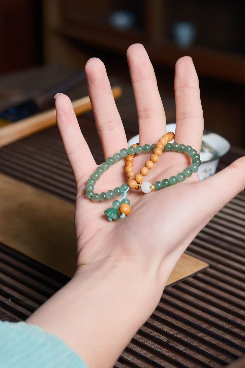 Sacred_Lotus_Jade_Sandalwood_Double-Loop_Bracelet_on_hand.pic