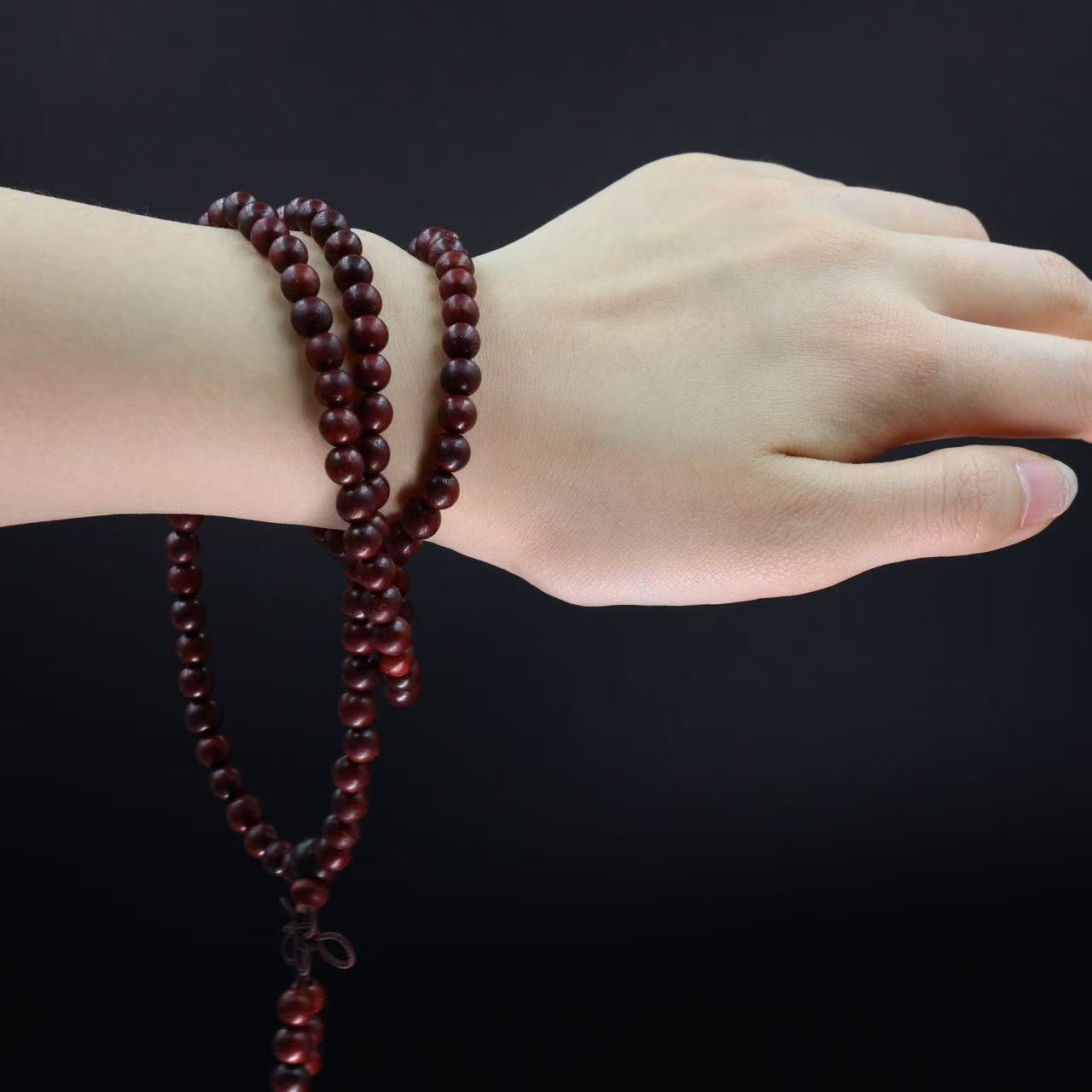108 smooth sandalwood bead meditation bracelet with natural wood grain for mindfulness practice on wrist